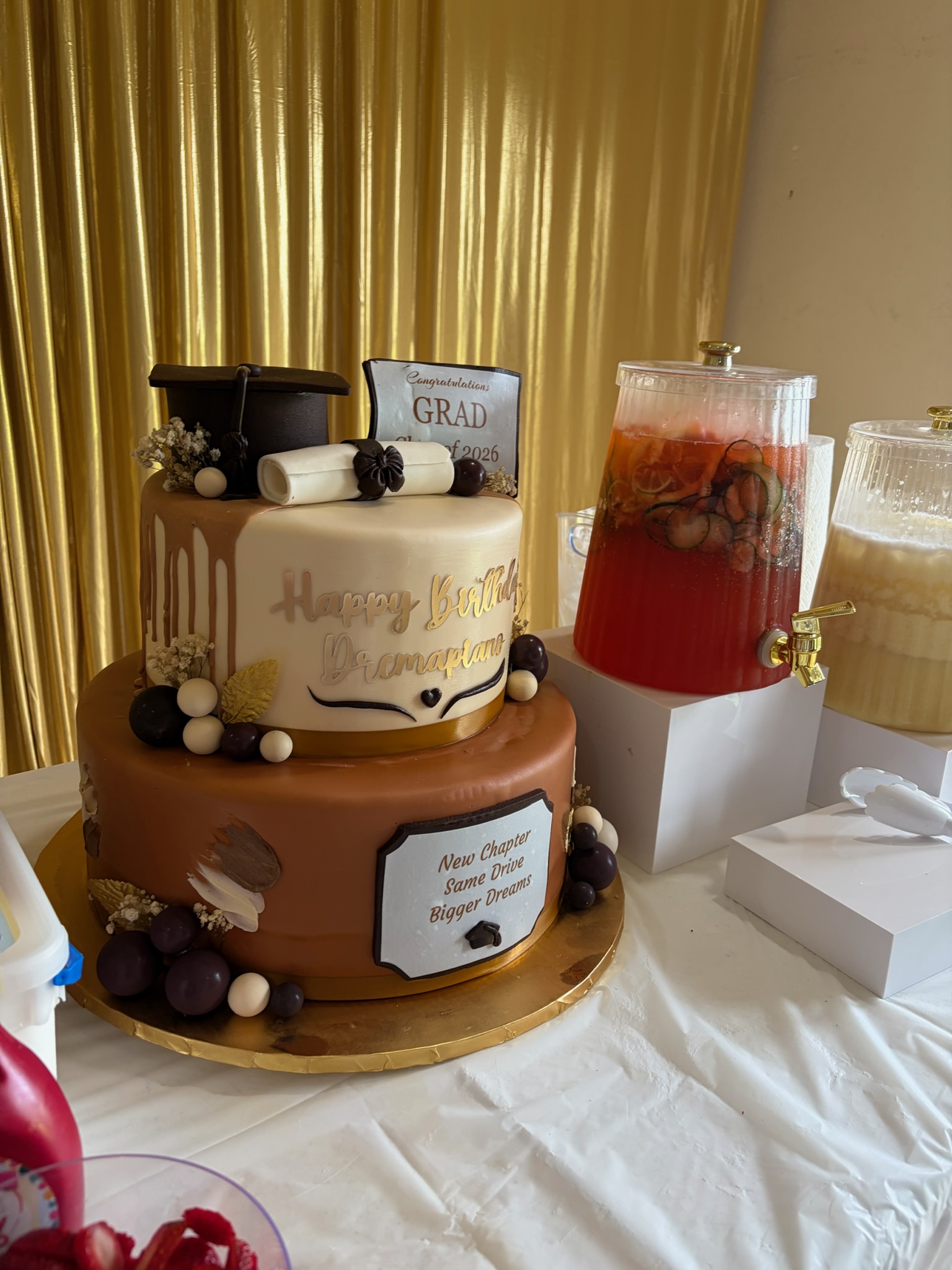 Two-tier cake with styled beverage display
